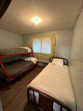 This bedroom has a double bunk/twin on top & a twin bed. Other bedroom (not pictured) has the 2 double bunks